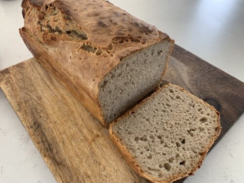 Sour Dough cooked in a large metal loaf tin.