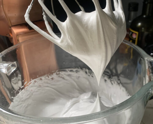 half a can of aquafaba, whisked into very stiff peaks, with 3/4 cup of sugar.